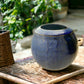 Wheel-Thrown Pottery Art Piece- Channel Cut Orb, Multiple Shades of Blue, with Copper Color and Speckles, Dimensions:  6h"x 6w"
